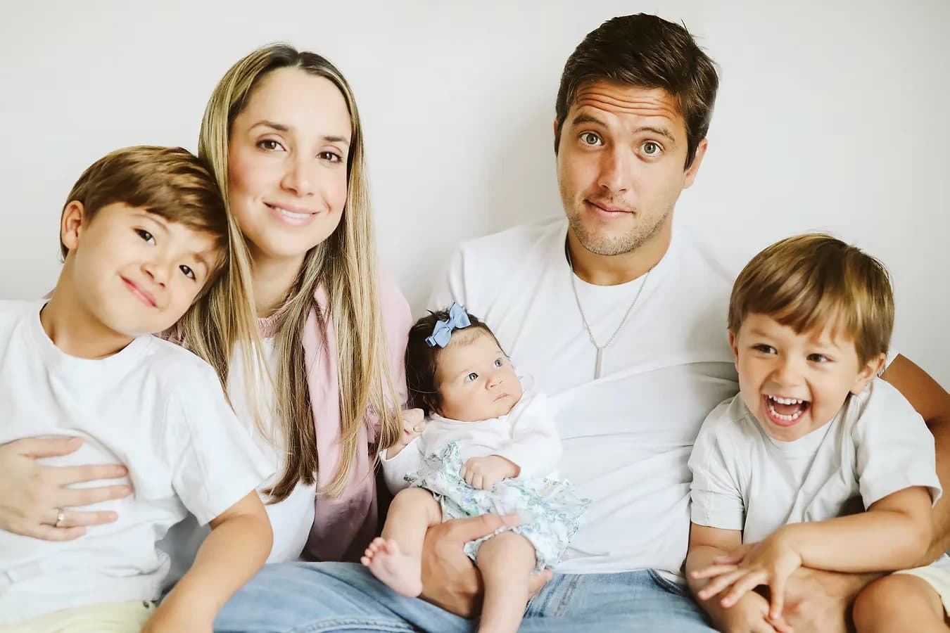 Family studio portrait in white and blush